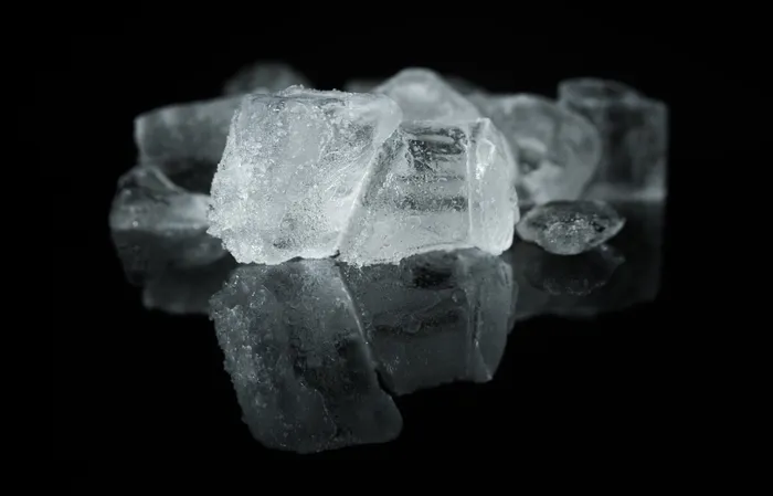 Ice cubes on a dark surface