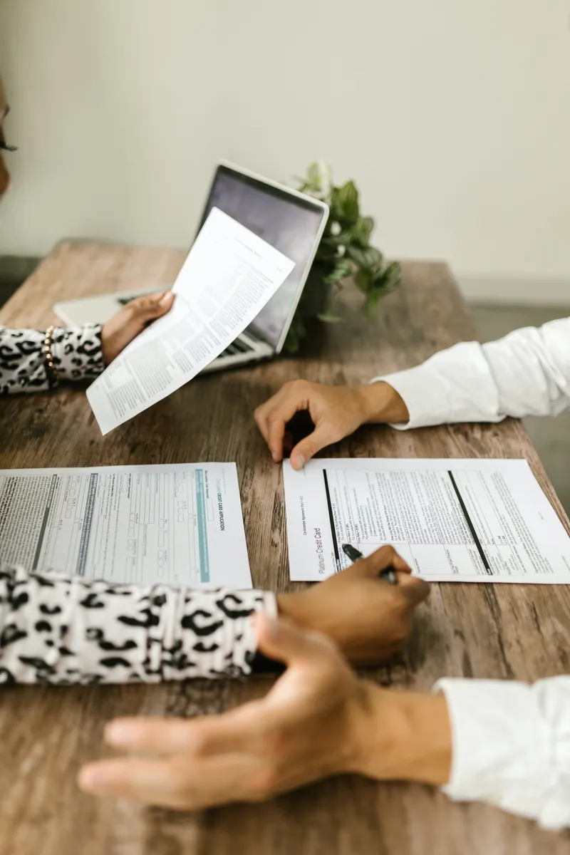 People reviewing insurance paperwork at a table