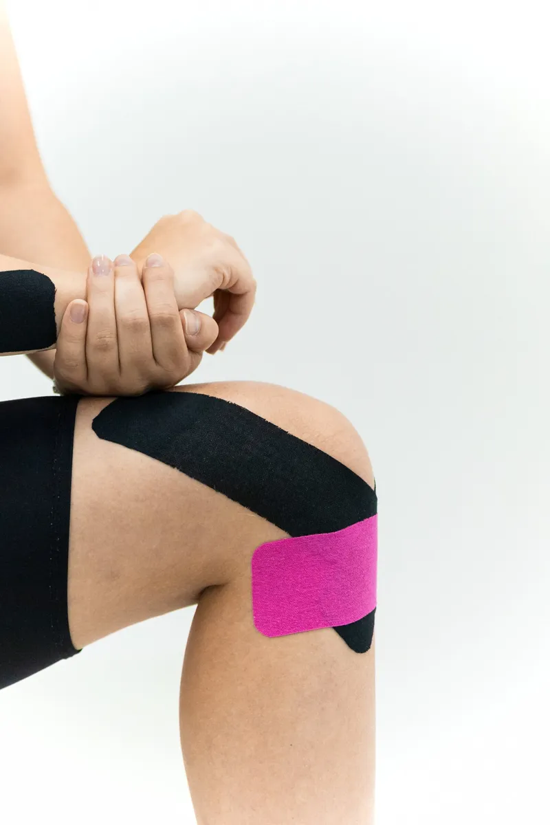 Kinesiology tape applied to a knee
